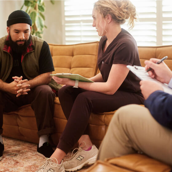 a group of people sitting on a couch